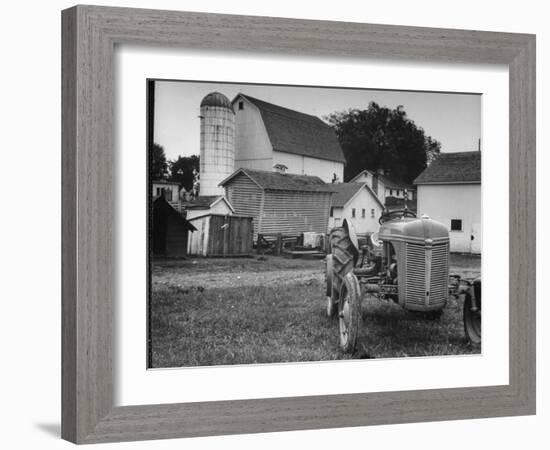 A Ford Tractor Being Sold During the Farmhouse Auction-null-Framed Photographic Print