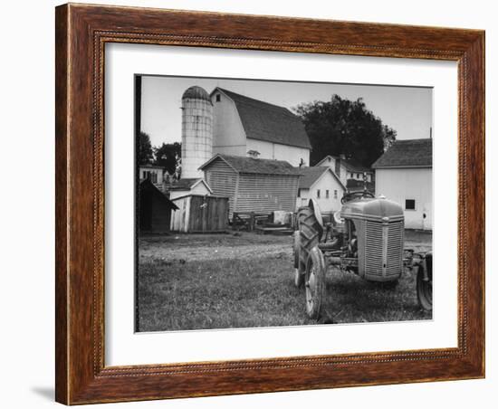 A Ford Tractor Being Sold During the Farmhouse Auction-null-Framed Photographic Print