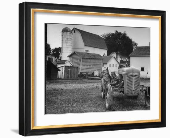 A Ford Tractor Being Sold During the Farmhouse Auction-null-Framed Photographic Print