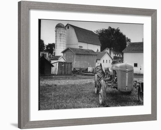 A Ford Tractor Being Sold During the Farmhouse Auction-null-Framed Photographic Print