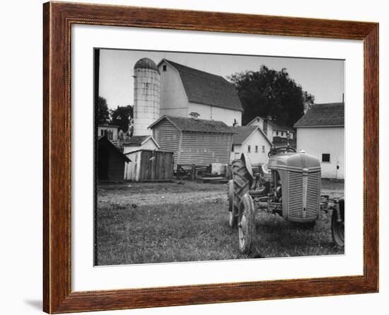 A Ford Tractor Being Sold During the Farmhouse Auction-null-Framed Photographic Print