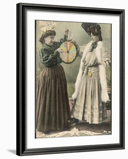 A Fortune-Teller Uses a 'Wheel of Fortune'-null-Framed Photographic Print