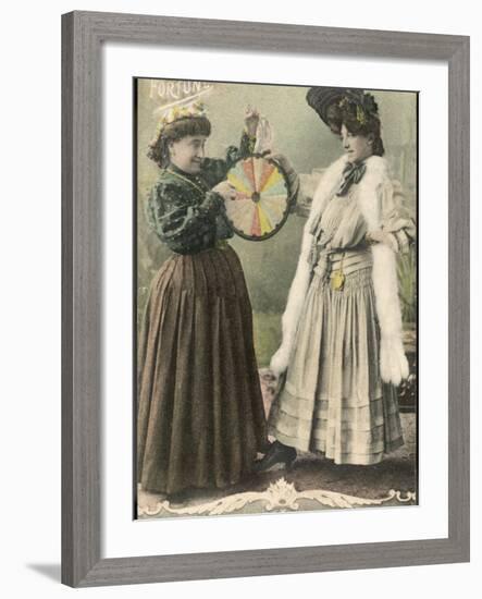 A Fortune-Teller Uses a 'Wheel of Fortune'-null-Framed Photographic Print