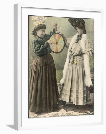 A Fortune-Teller Uses a 'Wheel of Fortune'-null-Framed Photographic Print