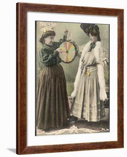 A Fortune-Teller Uses a 'Wheel of Fortune'-null-Framed Photographic Print