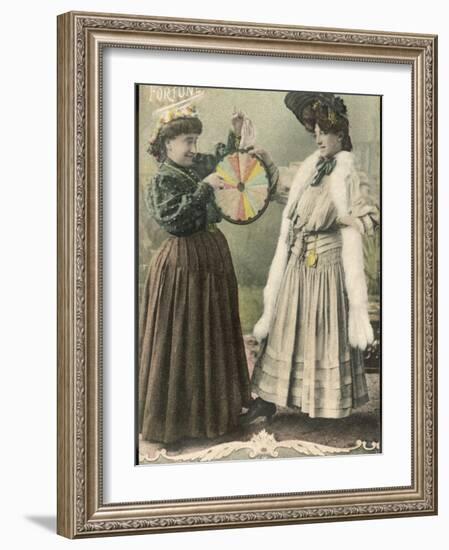 A Fortune-Teller Uses a 'Wheel of Fortune'-null-Framed Photographic Print