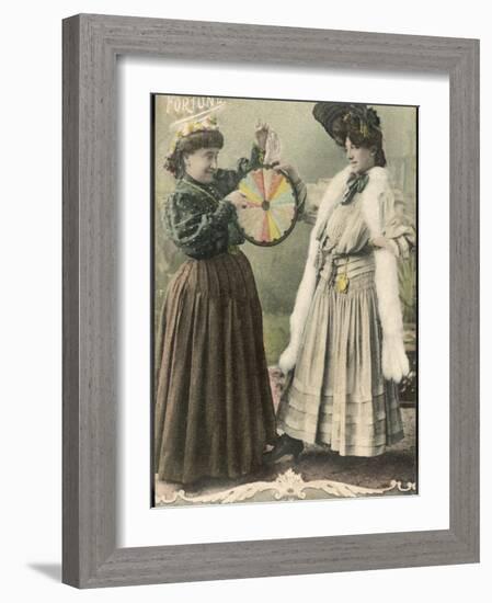 A Fortune-Teller Uses a 'Wheel of Fortune'-null-Framed Photographic Print