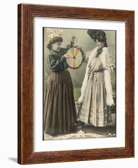 A Fortune-Teller Uses a 'Wheel of Fortune'-null-Framed Photographic Print