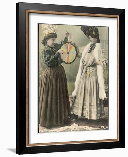 A Fortune-Teller Uses a 'Wheel of Fortune'-null-Framed Photographic Print