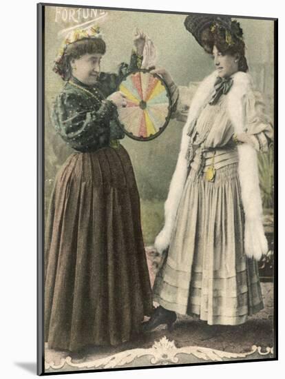 A Fortune-Teller Uses a 'Wheel of Fortune'-null-Mounted Photographic Print