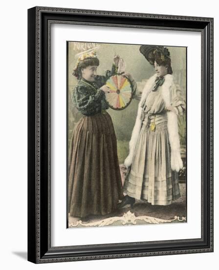 A Fortune-Teller Uses a 'Wheel of Fortune'-null-Framed Photographic Print