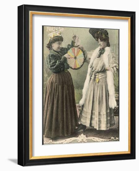 A Fortune-Teller Uses a 'Wheel of Fortune'-null-Framed Photographic Print