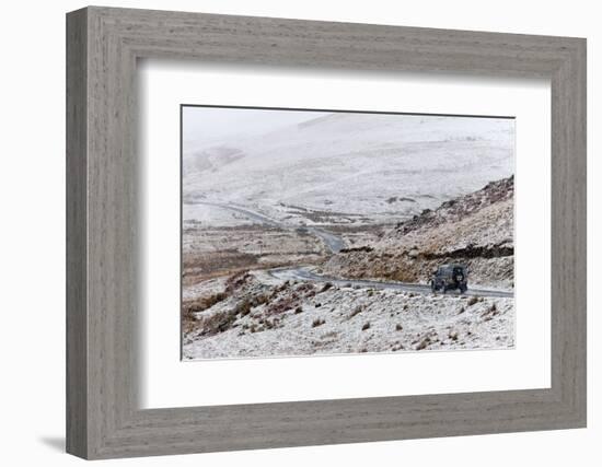 A Four Wheel Drive Vehicle Negotiates a Road Through a Wintry Landscape in Elan Valley Area, Wales-Graham Lawrence-Framed Photographic Print