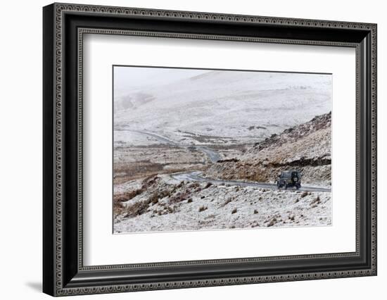 A Four Wheel Drive Vehicle Negotiates a Road Through a Wintry Landscape in Elan Valley Area, Wales-Graham Lawrence-Framed Photographic Print