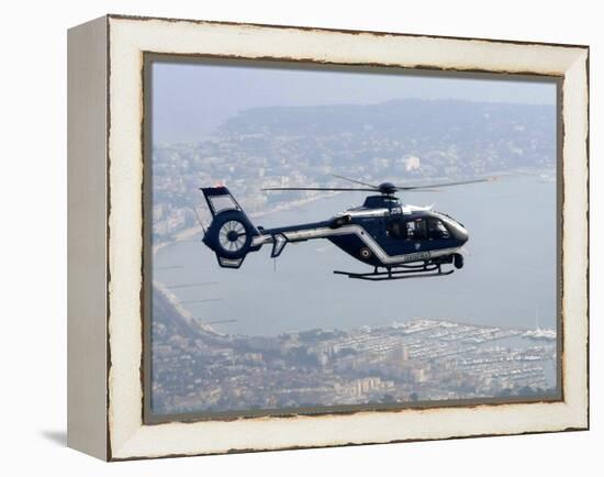 A Gendarme Helicopter is Seen Above the Bay of Cannes-Michel Spingler-Framed Premier Image Canvas