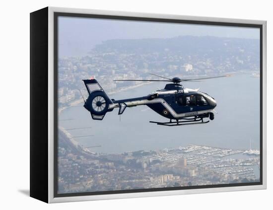 A Gendarme Helicopter is Seen Above the Bay of Cannes-Michel Spingler-Framed Premier Image Canvas