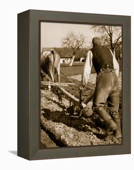 A German Farmer at Work-German photographer-Framed Premier Image Canvas