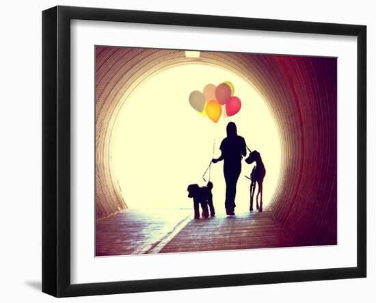 A Girl at the End of a Tunnel Holding Balloons and Two Dogs Done with an Instagram Vintage Retro Fi-graphicphoto-Framed Photographic Print