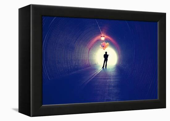 A Girl at the End of a Tunnel Holding Balloons-graphicphoto-Framed Premier Image Canvas