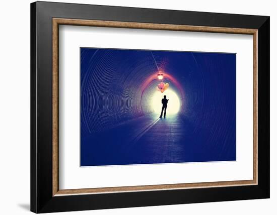 A Girl at the End of a Tunnel Holding Balloons-graphicphoto-Framed Photographic Print