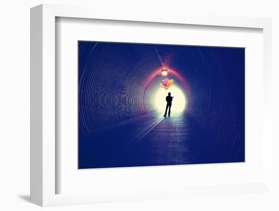 A Girl at the End of a Tunnel Holding Balloons-graphicphoto-Framed Photographic Print