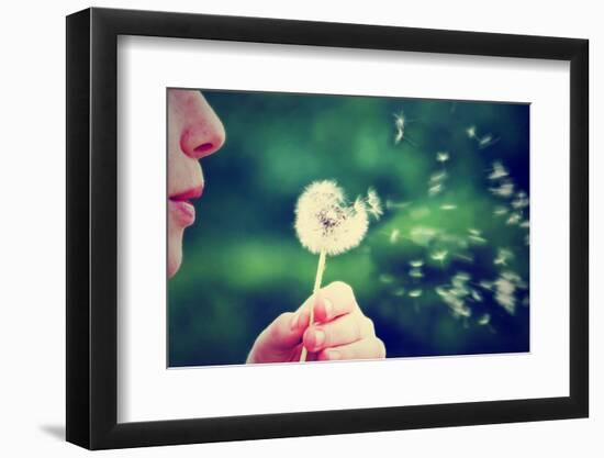 A Girl Blowing on a Dandelion-graphicphoto-Framed Photographic Print