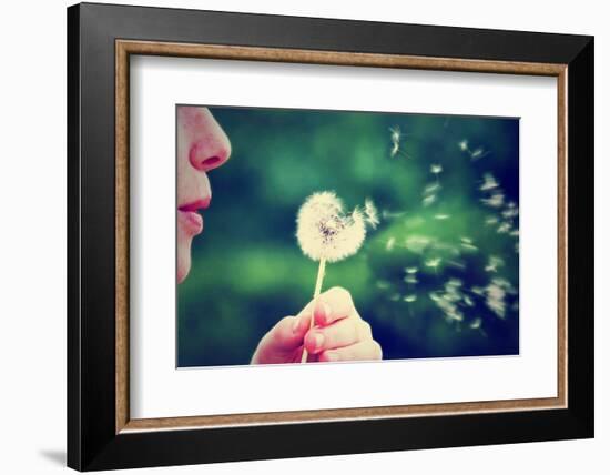 A Girl Blowing on a Dandelion-graphicphoto-Framed Photographic Print