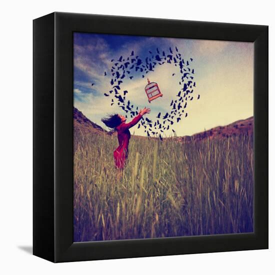 A Girl in a Field Tossing a Birdcage in the Air with Birds Flying in the Shape of a Heart Toned Wit-graphicphoto-Framed Premier Image Canvas