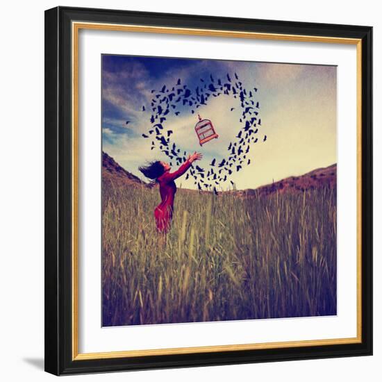 A Girl in a Field Tossing a Birdcage in the Air with Birds Flying in the Shape of a Heart Toned Wit-graphicphoto-Framed Photographic Print