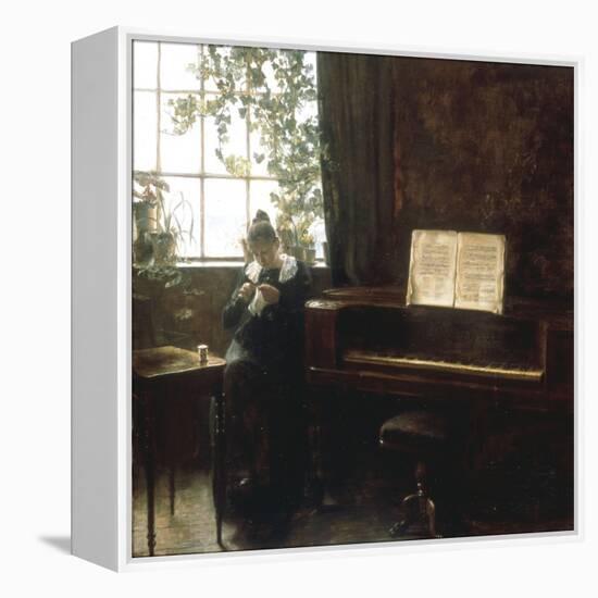 A Girl Knitting by the Window-Carl Holsoe-Framed Premier Image Canvas