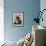 A Girl Rests on a Boat Below the Chinese National Flag-null-Framed Photographic Print displayed on a wall