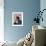 A Girl Rests on a Boat Below the Chinese National Flag-null-Framed Photographic Print displayed on a wall