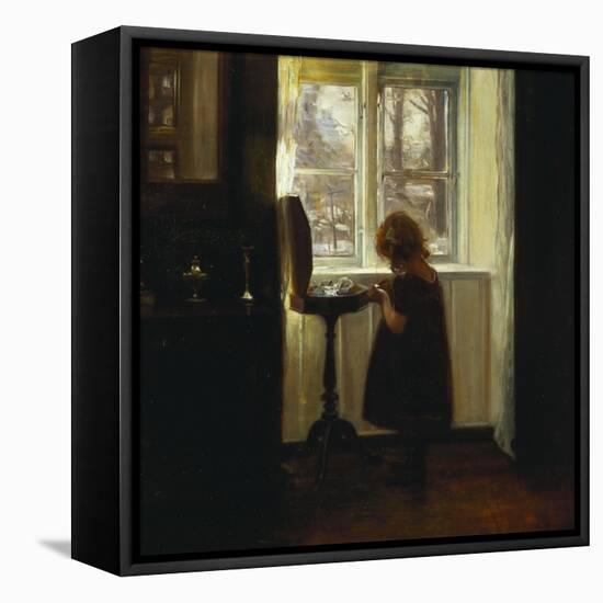 A Girl Standing by a Sewing Table-Carl Holsoe-Framed Premier Image Canvas