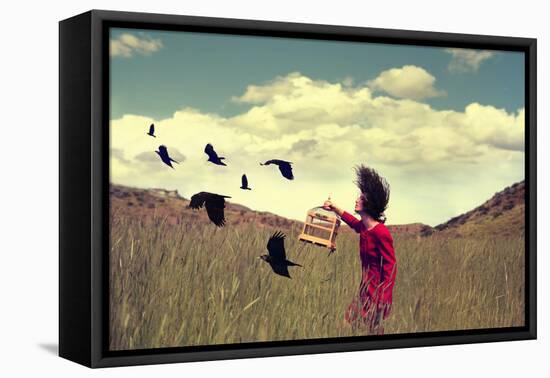 A Girl Walking through a Field with a Flock of Ravens or Crows Toned with a Retro Vintage Instagram-Annette Shaff-Framed Premier Image Canvas