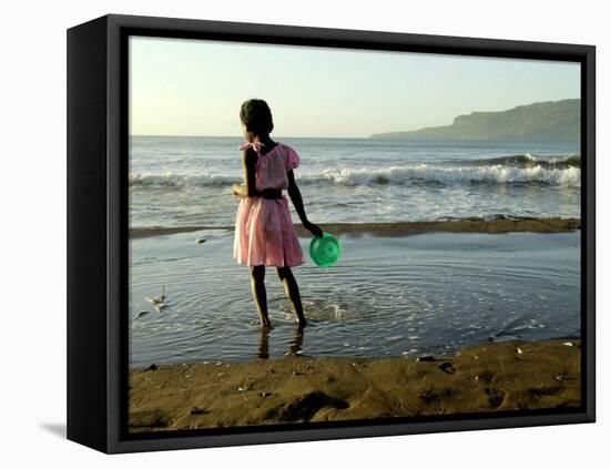 A Girl Walks on the Beach in Jacmel, Haiti, in This February 5, 2001-Lynne Sladky-Framed Premier Image Canvas