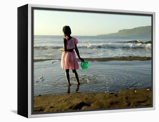 A Girl Walks on the Beach in Jacmel, Haiti, in This February 5, 2001-Lynne Sladky-Framed Premier Image Canvas