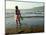 A Girl Walks on the Beach in Jacmel, Haiti, in This February 5, 2001-Lynne Sladky-Mounted Photographic Print