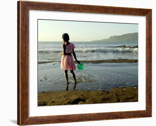 A Girl Walks on the Beach in Jacmel, Haiti, in This February 5, 2001-Lynne Sladky-Framed Photographic Print
