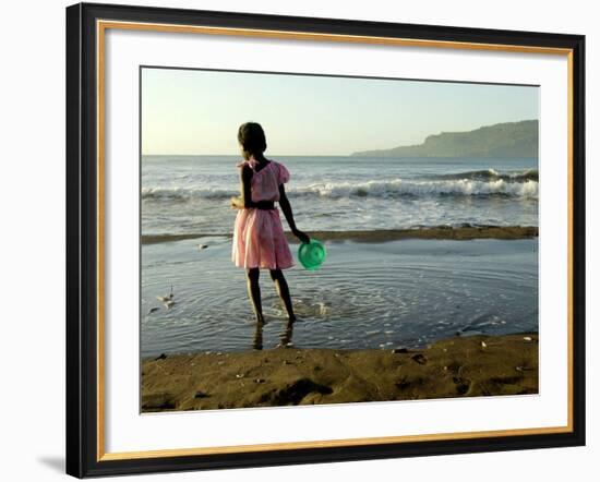 A Girl Walks on the Beach in Jacmel, Haiti, in This February 5, 2001-Lynne Sladky-Framed Photographic Print