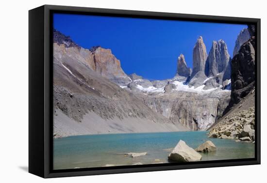 A glacial lake and the rock towers that give the Torres del Paine range its name, Torres del Paine-Alex Robinson-Framed Premier Image Canvas