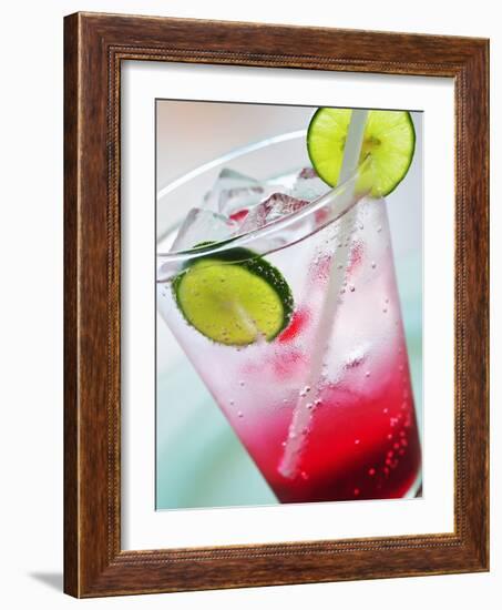 A Glass of Raspberry Soda with Ice Cubes and Lime Slices-null-Framed Photographic Print