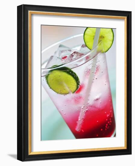 A Glass of Raspberry Soda with Ice Cubes and Lime Slices-null-Framed Photographic Print