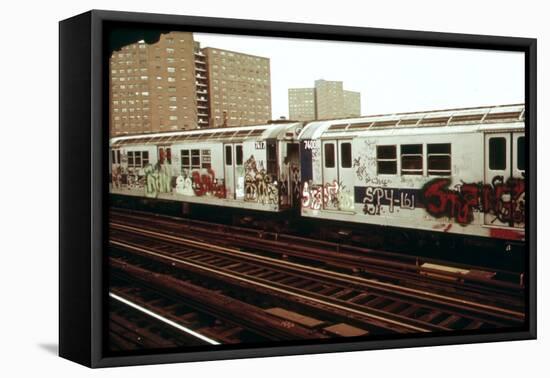 A Graffiti Painted Subway Train with Housing Projects in the Background, May 1973-null-Framed Stretched Canvas