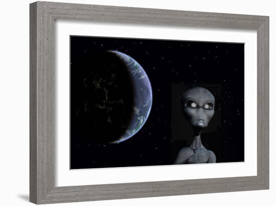 A Grey Alien with Planet Earth in the Background-null-Framed Art Print