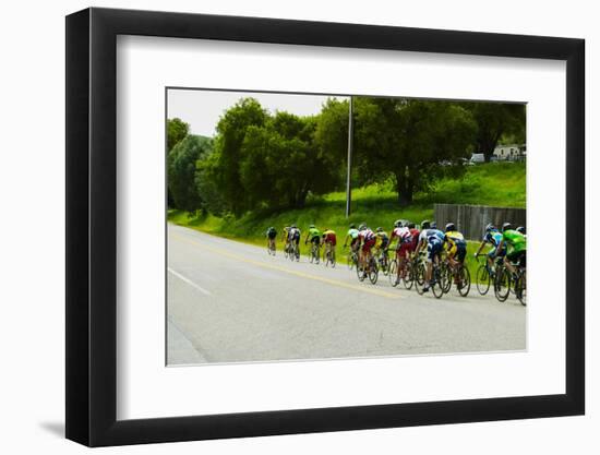 A group of road bicyclists traveling across highway 58 in CA-null-Framed Photographic Print