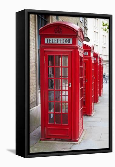 A Group of Typical Red London Phone Cabins-Kamira-Framed Premier Image Canvas