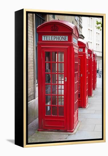 A Group of Typical Red London Phone Cabins-Kamira-Framed Premier Image Canvas