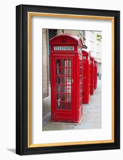 A Group of Typical Red London Phone Cabins-Kamira-Framed Photographic Print