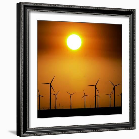 A Group of Wind Turbines are Silhouetted by the Setting Sun-Charlie Riedel-Framed Photographic Print