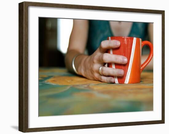 A Hand Holding a Red Mug-Katrin Adam-Framed Photographic Print